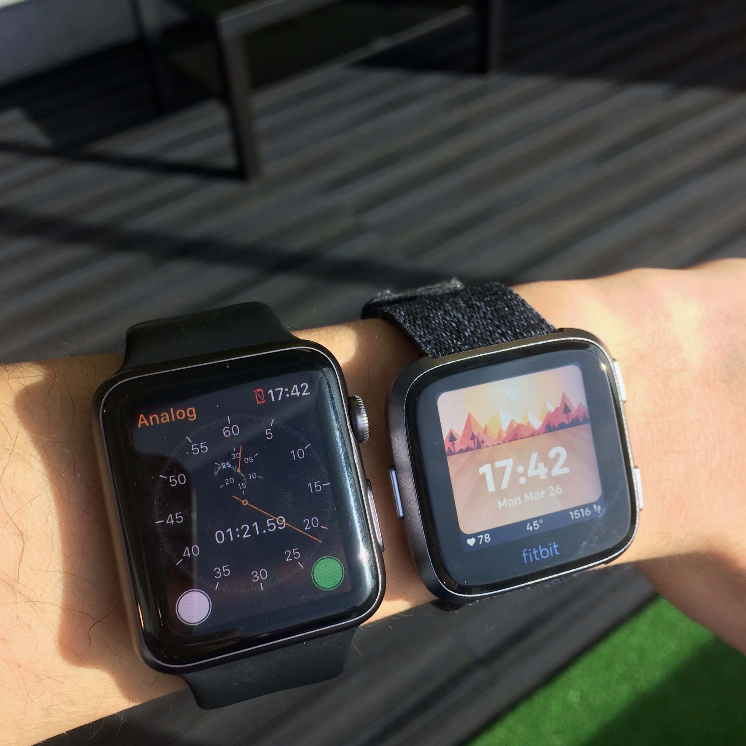Fitbit Versa on wrist compared to Apple Watch